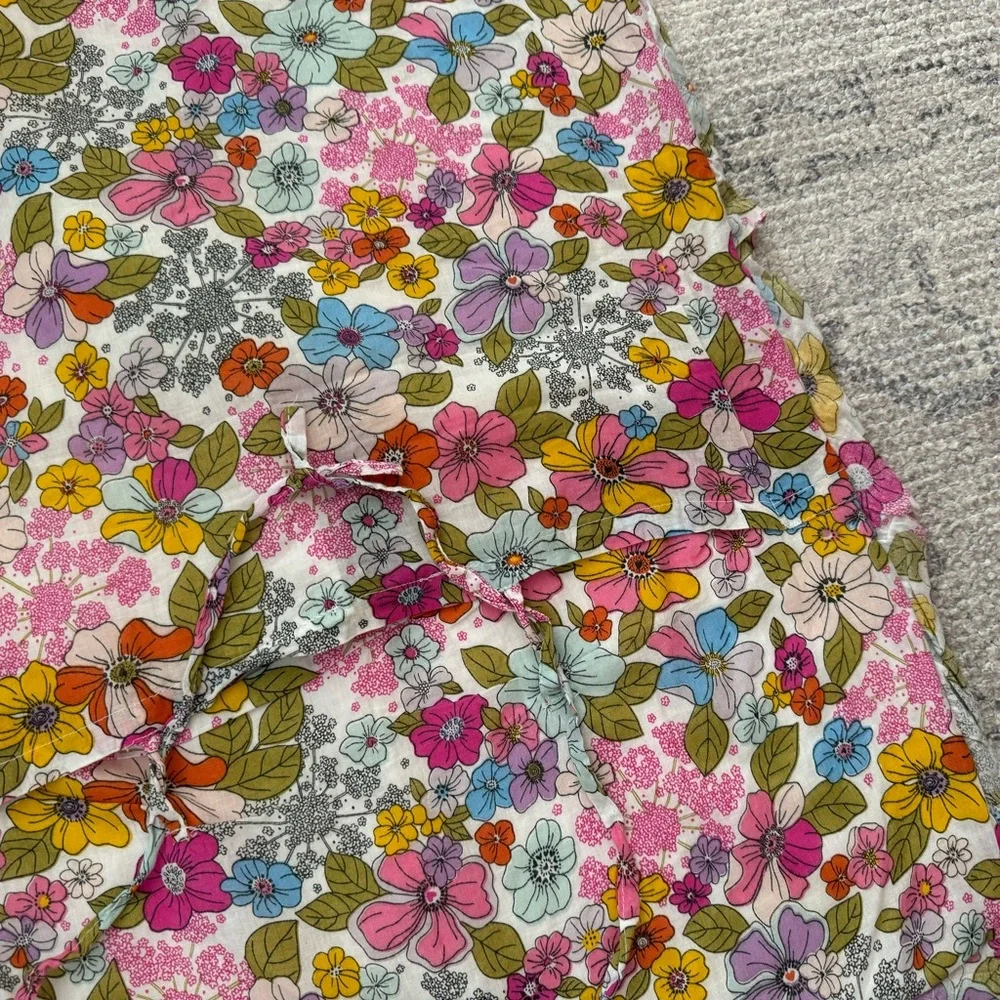 Cynthia Rowley quilted pillow sham with a multicolored boho floral pattern.